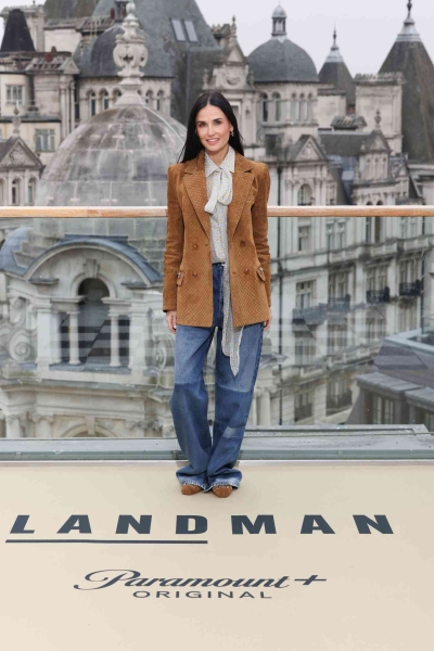 Demi Moore leaned into winter florals wearing a gray checkered skirt suit that went all the way to her ankles for the UK screening of 'Landman' on Friday, November 8 in London. Just hours earlier, the actress wore a caramel Gucci horsebit jacket paired with matching ballet flats and a pussy bow blouse.