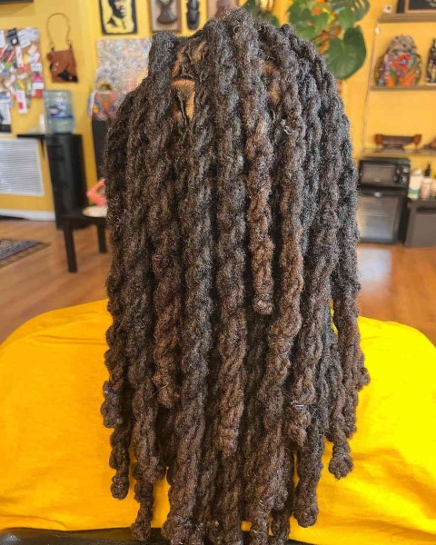 Dreadlock hairstyles can range from ponytails, twists, braids, and more. Get inspiration for dreadlocks styles for Black women, here.