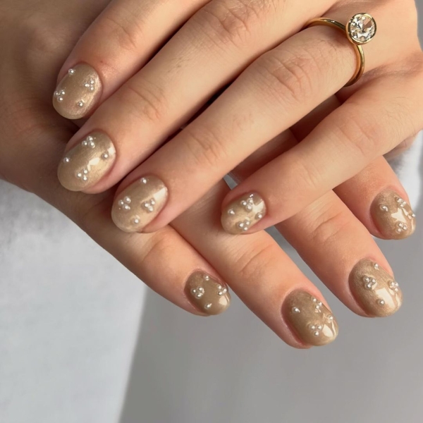 Embrace winter nail designs by incorporating elements like cool-toned colors and cable-knit textures. Scroll through 50 inspirational photos here.