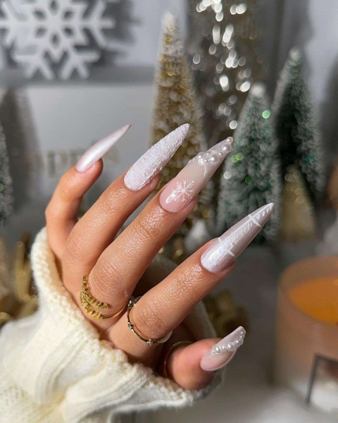 Embrace winter nail designs by incorporating elements like cool-toned colors and cable-knit textures. Scroll through 50 inspirational photos here.