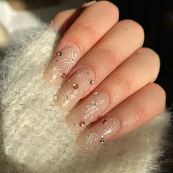 Embrace winter nail designs by incorporating elements like cool-toned colors and cable-knit textures. Scroll through 50 inspirational photos here.