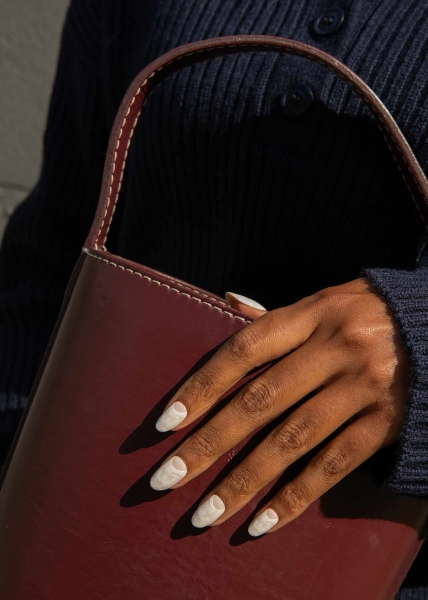 Embrace winter nail designs by incorporating elements like cool-toned colors and cable-knit textures. Scroll through 50 inspirational photos here.