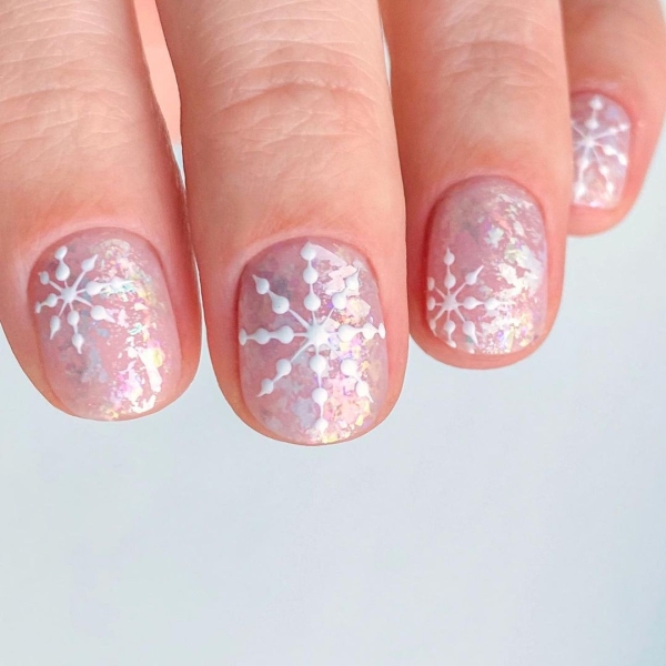 Embrace winter nail designs by incorporating elements like cool-toned colors and cable-knit textures. Scroll through 50 inspirational photos here.