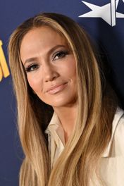 Jennifer Lopez wore a little black dress that had a deep plunging neckline and a bow embellishment. See the outfit here.