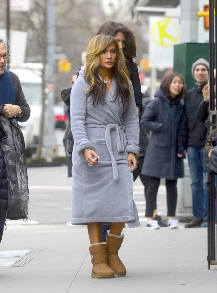 Jennifer Lopez's latest outfit is our Fall uniform: cozy sweater, bold jeans, and the most Y2K boots ever.