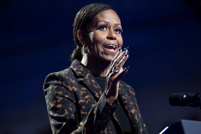 Kamala Harris wore a caramel pantsuit with a street style detail while campaigning alongside Michelle Obama in Michigan on Saturday, October 26.