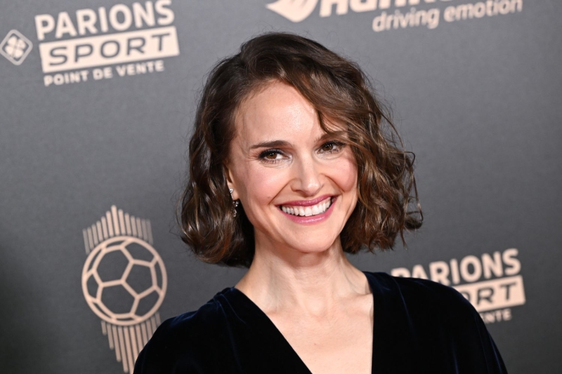 Natalie Portman showed off a dramatic new curly dark copper lob with a plunging navy velvet gown as she attended the 68th Ballon D'Or Photocall in Paris on Monday, October 28.