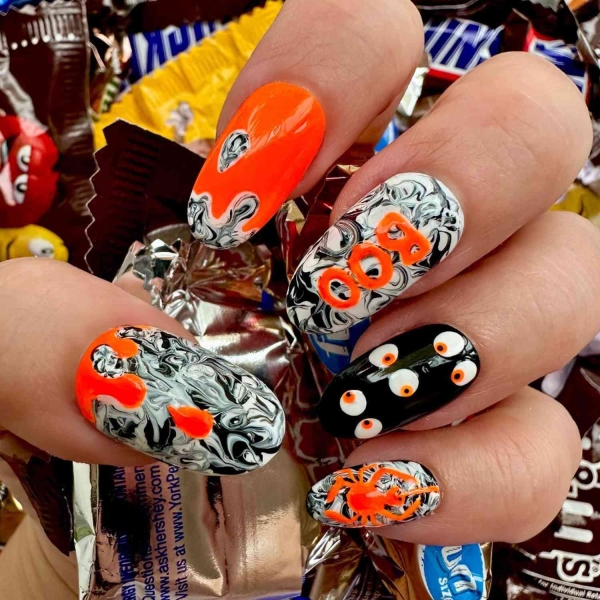 Nothing says spooky season like short Halloween nails. Here, explore 17 short Halloween nail designs that are a whole mood.