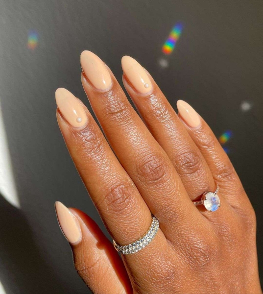 Nude nail colors are flesh-toned shades that provide a seamless transition from nail to skin. Check out 21 nude polishes for light, medium, and deep skin tones.