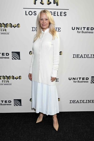 Pamela Anderson attended the 'Deadline' Contenders Film event in Los Angeles while wearing another all-white outfit that included a divisive tunic top and pleated skirt. See her full look, here.