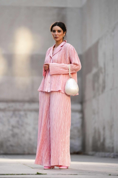 Satin pajama sets have become a street style staple and we've got 14 fresh ways to wear them. Here's how to wear a satin pajama set outside of the house for date night, brunch, and everything in between.