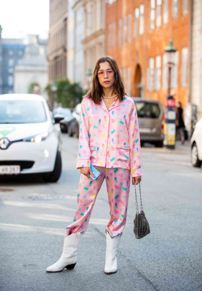 Satin pajama sets have become a street style staple and we've got 14 fresh ways to wear them. Here's how to wear a satin pajama set outside of the house for date night, brunch, and everything in between.