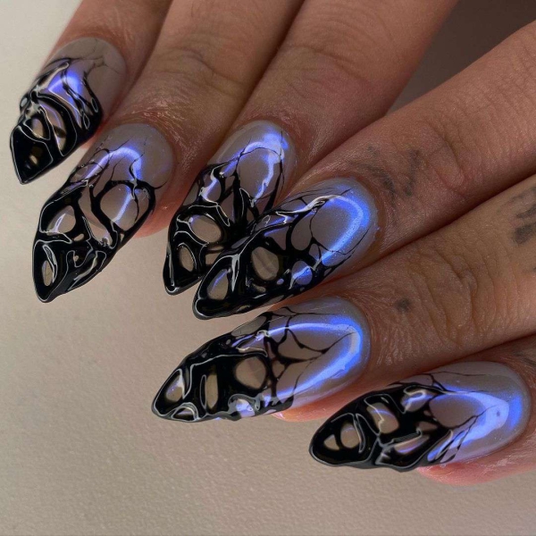 Scorpios are mysterious, passionate, magnetic, and ambitious. So to honor the sign through a manicure, the look should be anything but simple. Here are 20 befitting looks.