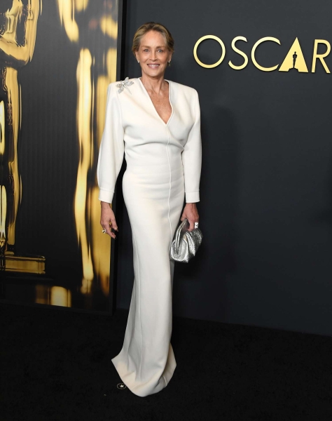 Sharon Stone attended the 2024 Governor's Awards in a winter white gown and barely-there glam. See her look, here.