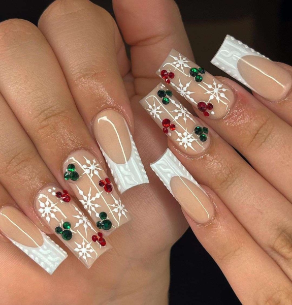 Snowflake nail art is a classic look that can be worn throughout fall and winter. Whether you want a detailed snowflake on each finger, or you want your nails to look flocked, snowy nails are all up to your personal interpretation. We share some of the best versions of the trend, here.