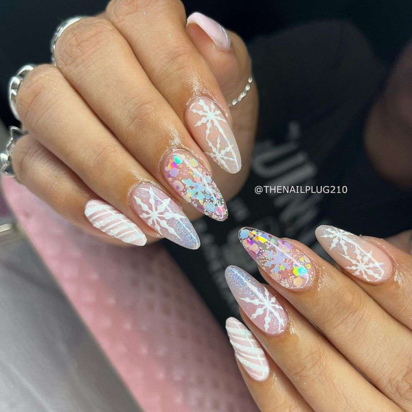 Snowflake nail art is a classic look that can be worn throughout fall and winter. Whether you want a detailed snowflake on each finger, or you want your nails to look flocked, snowy nails are all up to your personal interpretation. We share some of the best versions of the trend, here.