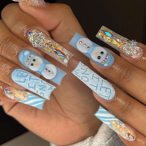 Snowflake nail art is a classic look that can be worn throughout fall and winter. Whether you want a detailed snowflake on each finger, or you want your nails to look flocked, snowy nails are all up to your personal interpretation. We share some of the best versions of the trend, here.