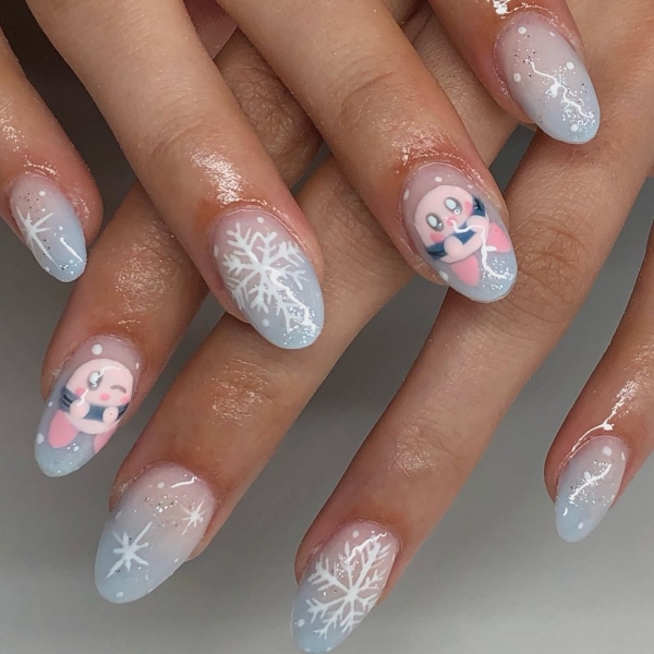 Snowflake nail art is a classic look that can be worn throughout fall and winter. Whether you want a detailed snowflake on each finger, or you want your nails to look flocked, snowy nails are all up to your personal interpretation. We share some of the best versions of the trend, here.