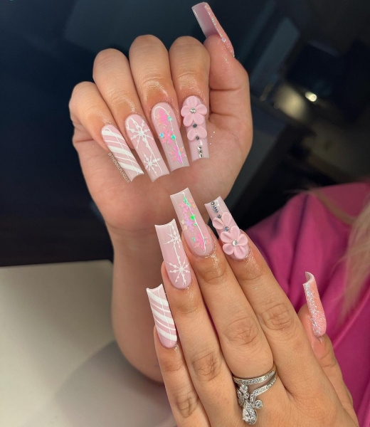 Snowflake nail art is a classic look that can be worn throughout fall and winter. Whether you want a detailed snowflake on each finger, or you want your nails to look flocked, snowy nails are all up to your personal interpretation. We share some of the best versions of the trend, here.