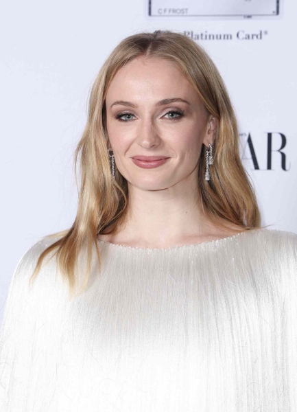 Sophie Turner wore a white fringe minidress that looked like a 'Game of Thrones' character Daenerys Targaryen's platinum blonde hair. See her bold look, here.