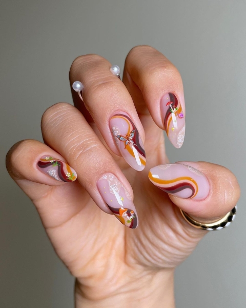 Thanksgiving nail designs can be as simple or intricate as you'd like. Browse 40 examples to serve as inspiration for a festive manicure this season.