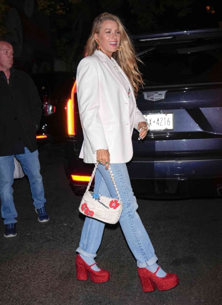 Blake Lively attended a screening of 'Wicked' in New York City with her husband, Ryan Reynolds, while wearing the ultimate 'Wizard of Oz' callback: a pair of Dorothy-coded ruby red platform heels. See her full look, here.