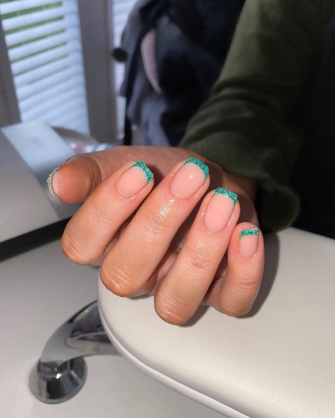 Celebrate the season with a festive manicure. Green Christmas nails run the gamut from minimalist to maximalist—there's something for everyone on the list.