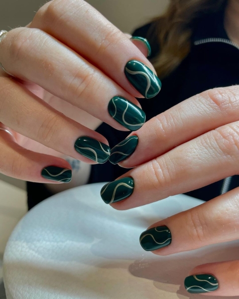 Celebrate the season with a festive manicure. Green Christmas nails run the gamut from minimalist to maximalist—there's something for everyone on the list.