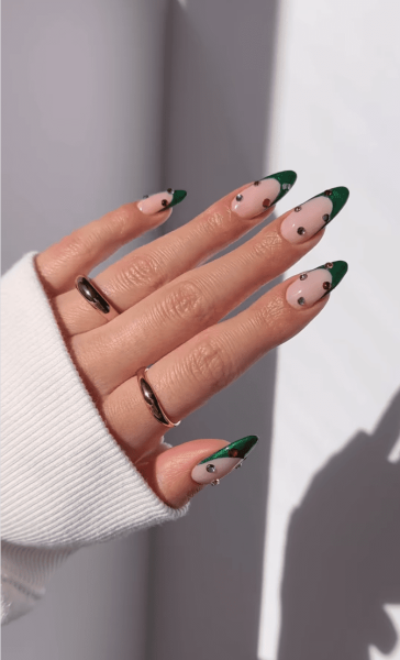 Celebrate the season with a festive manicure. Green Christmas nails run the gamut from minimalist to maximalist—there's something for everyone on the list.