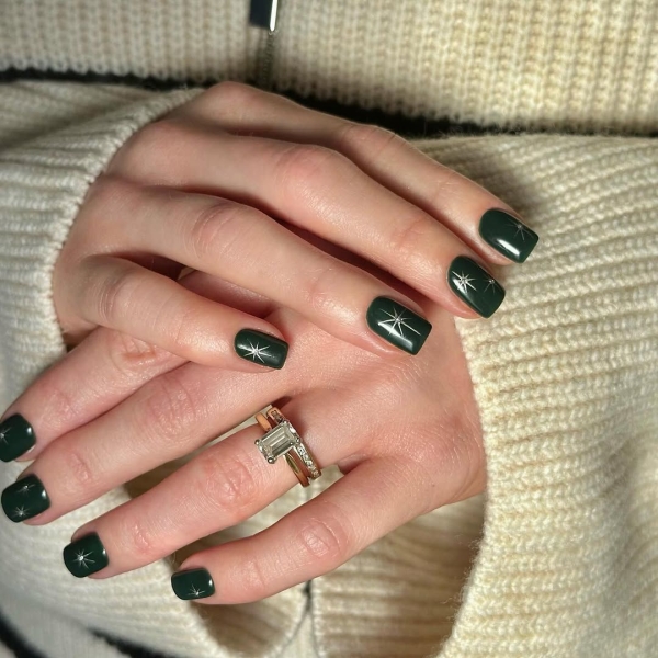 Celebrate the season with a festive manicure. Green Christmas nails run the gamut from minimalist to maximalist—there's something for everyone on the list.