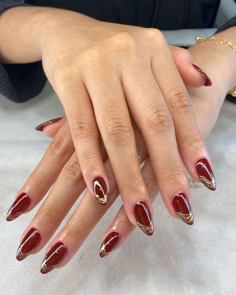 Few shades are as timeless as burgundy when it comes to fall and winter nail colors. This season, you can amplify its impact with a chrome effect, too. Scroll through 25 burgundy chrome nail looks for inspiration here.