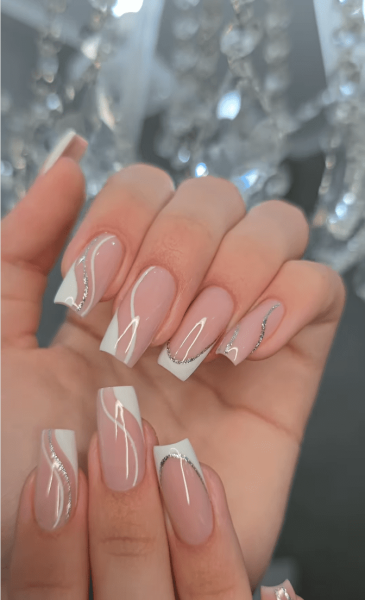 French manicures are a great option for a neutral nail look that goes with everything. For something a little more fun, but still sleek, try a glitter French manicure. Here, 15 gorgeous variations.