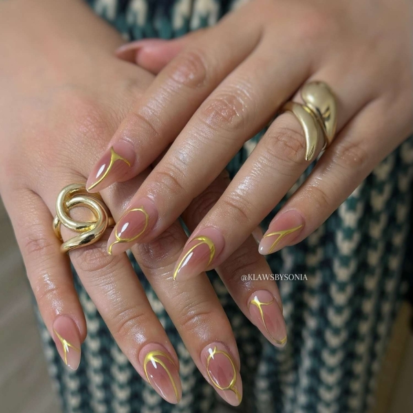 Gold is synonymous with luxury and glamour, making it perfect for the upcoming festive season. Scroll through these 20 stunning gold nail looks that we think you'll absolutely love.