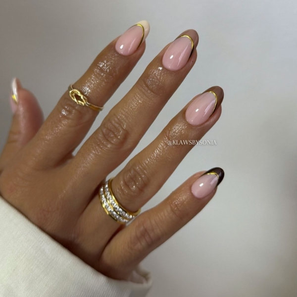 Gold is synonymous with luxury and glamour, making it perfect for the upcoming festive season. Scroll through these 20 stunning gold nail looks that we think you'll absolutely love.