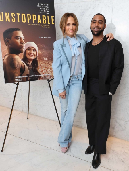 Jennifer Lopez wore a blue suit jacket with a sheer top and low rise denim jeans for her appearance at the 'Unstoppable' special screening at Creative Artists Agency on December 15 in Los Angeles