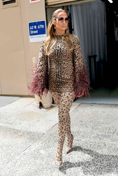 Jennifer Lopez wore one of this year's biggest coat trends as she paired a leopard-printed statement coat with divisive heels in Los Angeles on December 3. See the look, here.