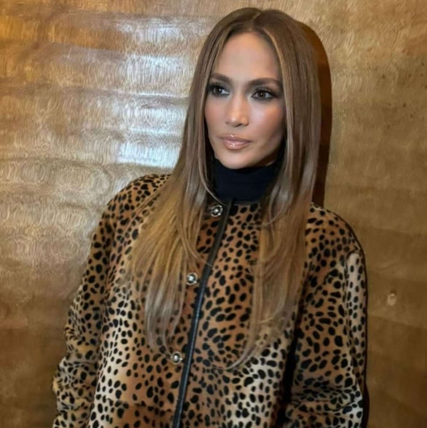 Jennifer Lopez wore one of this year's biggest coat trends as she paired a leopard-printed statement coat with divisive heels in Los Angeles on December 3. See the look, here.