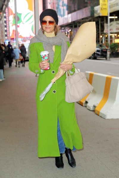 Katie Holmes wore a bright 'Brat' green coat during one of her daily New York City walks—and it could not be further from her regular normcore style.