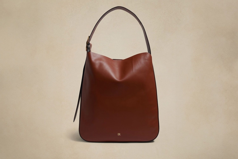 Katie Holmes wore winter’s no. 1 accessory: a practical bucket bag that is spacious, structured, and sleek for everyday use. I found eight lookalikes of her chocolate brown tote at Amazon, Nordstrom, Coach, and more, starting at $33.