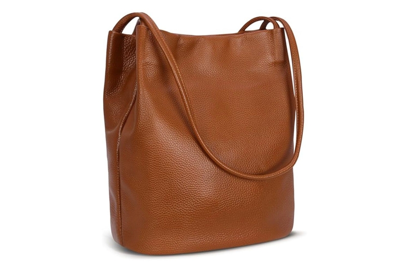 Katie Holmes wore winter’s no. 1 accessory: a practical bucket bag that is spacious, structured, and sleek for everyday use. I found eight lookalikes of her chocolate brown tote at Amazon, Nordstrom, Coach, and more, starting at $33.