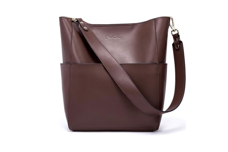 Katie Holmes wore winter’s no. 1 accessory: a practical bucket bag that is spacious, structured, and sleek for everyday use. I found eight lookalikes of her chocolate brown tote at Amazon, Nordstrom, Coach, and more, starting at $33.