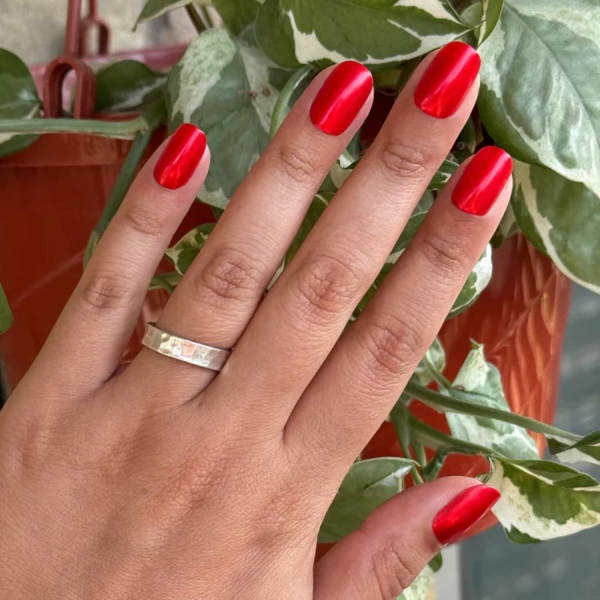 Looking for a little end-of-year mani inspo? Here, manicurists reveal their favorite December nail ideas. Along with the expected holly-jolly palettes, the nail artists we spoke with forecast bows, silver and gold accents, elevated French tips, and frosty chrome finishes to reign supreme this holiday season.