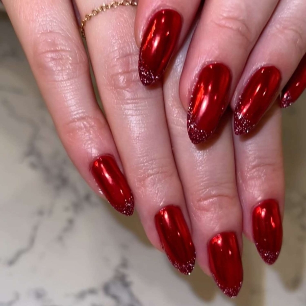 Looking for a little end-of-year mani inspo? Here, manicurists reveal their favorite December nail ideas. Along with the expected holly-jolly palettes, the nail artists we spoke with forecast bows, silver and gold accents, elevated French tips, and frosty chrome finishes to reign supreme this holiday season.