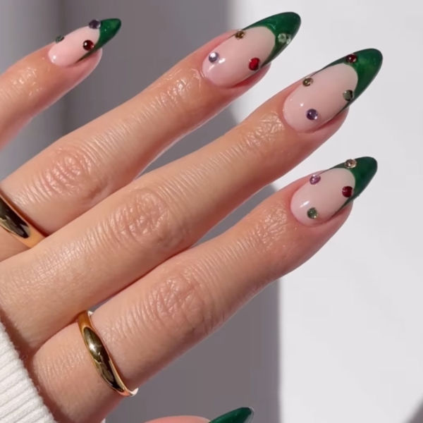 Looking for a little end-of-year mani inspo? Here, manicurists reveal their favorite December nail ideas. Along with the expected holly-jolly palettes, the nail artists we spoke with forecast bows, silver and gold accents, elevated French tips, and frosty chrome finishes to reign supreme this holiday season.