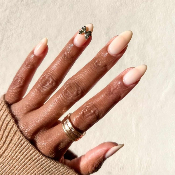 Looking for a little end-of-year mani inspo? Here, manicurists reveal their favorite December nail ideas. Along with the expected holly-jolly palettes, the nail artists we spoke with forecast bows, silver and gold accents, elevated French tips, and frosty chrome finishes to reign supreme this holiday season.