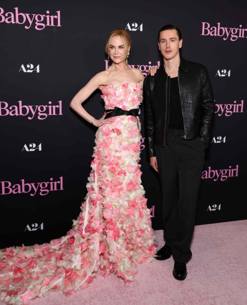 Nicole Kidman wore a dress made of cascading appliqué pink flowers while attending the Los Angeles premiere of A24's 'Babygirl,' which she stars in opposite Harris Dickinson.