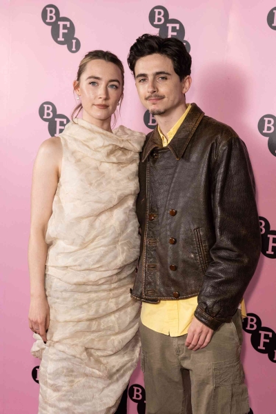 Saoirse Ronan appeared at a special event with three-time co-star Timothée Chalamet wearing a pale pink organza funnel dress by Khaite that looked as comfy as a sleeping bag.