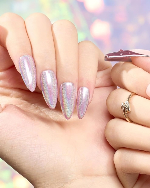 Shimmery nails will never go out of style—they just keep getting better. Simple glitter nails gave way to technicolored holographic finishes. Here's how to recreate the stunning look on your own.