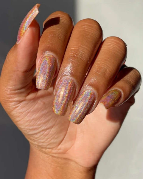 Shimmery nails will never go out of style—they just keep getting better. Simple glitter nails gave way to technicolored holographic finishes. Here's how to recreate the stunning look on your own.