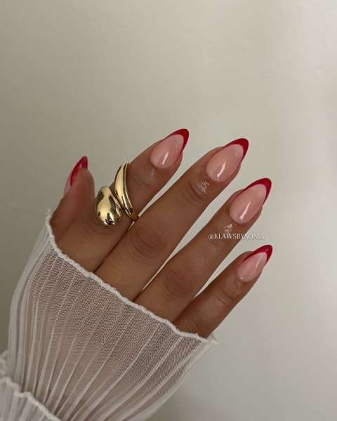 The color red is synonymous with Christmas and warm holiday cheer. Here, scroll through 18 red Christmas nail ideas for a festive touch this season.